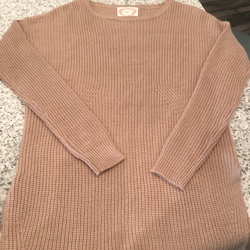 Cute and cozy tan sweater with side-slit detail!